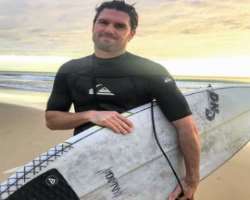 He enjoys water surfing in his free time.